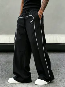 Men’s summer quick-dry breathable long pants — black loose athletic pants with white striped accents and “B” letter print, drawstring elastic waistband; suitable for gym and everyday wear.