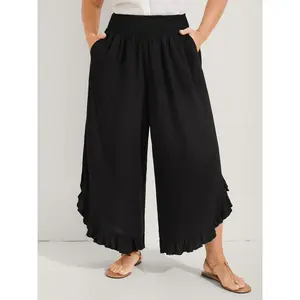 Black ruffle-hem wide-leg pants in a minimalist fit, made from rayon/hemp blend with pockets—ideal for vacation wear, travel, and casual comfort. Perfect as an Easter, Mother’s Day, or spring break gift (2026). GARMENTARY