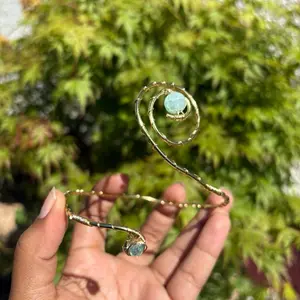 Light Sky Blue Arm Cuff - Has baby blue glass bead and is accented with thin gold, brass wire.