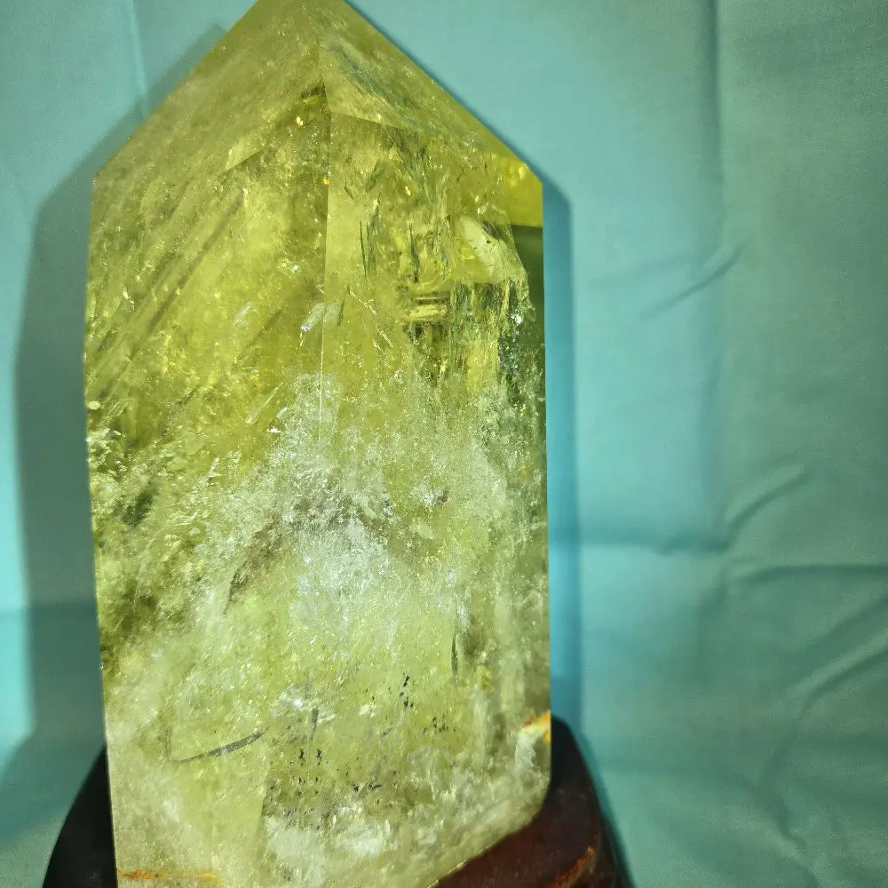 citrine point with wooden stand