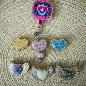 Charms for Badge Reels with Heart and Wing Designs in Pastel Colors