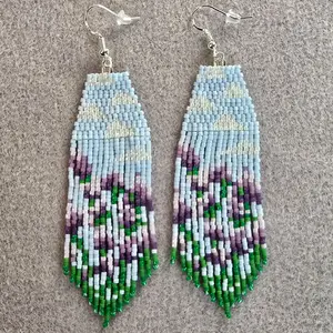 Brick Stitch and Fringe Beaded Earrings Featuring Purple Flowers with Clouds in the Background Handcrafted Jewelry Indigenous Made