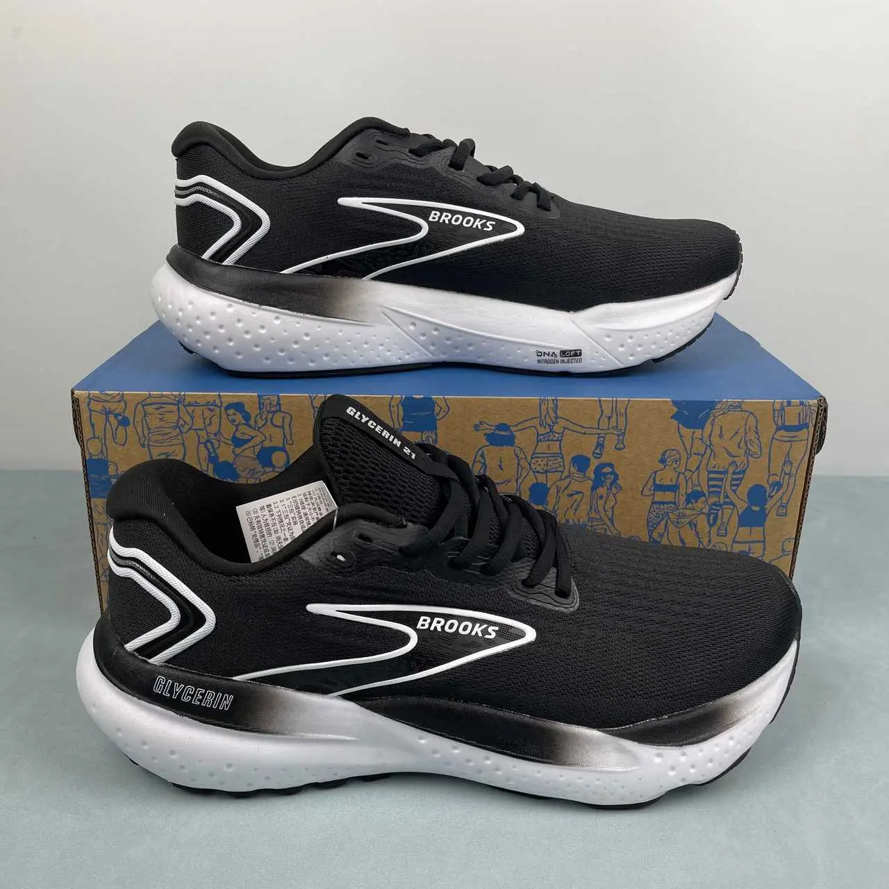 Perforated breathable mesh hybrid running trainers built for versatile striking black-white all-season minimalist casual street fashion aesthetics, dense solid black perforated mesh shell layered with clean white graphic overlay accents