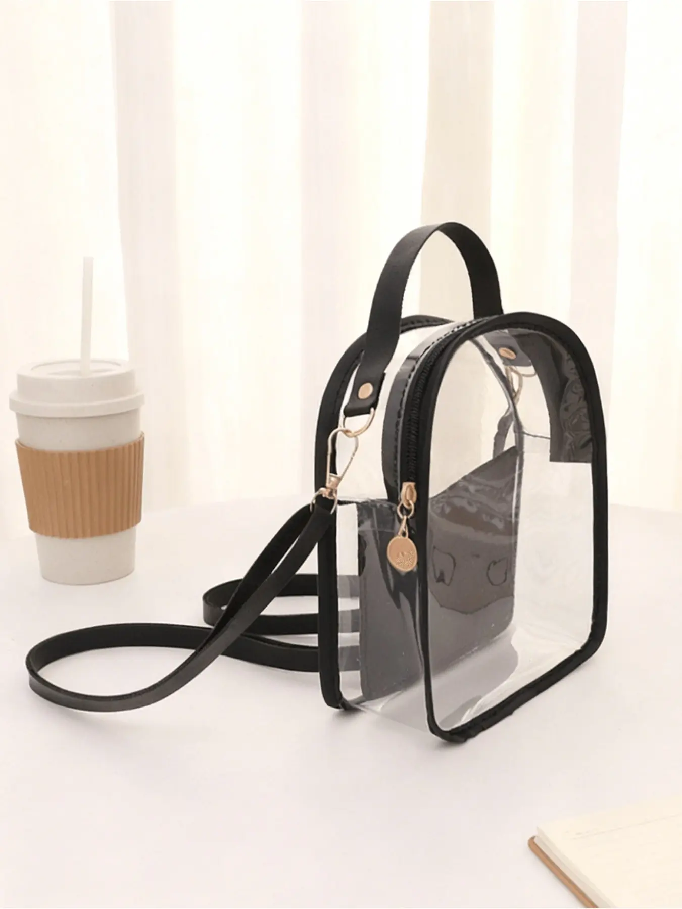 Transparent backpack lunch bag, meeting the standards for sports venues, with adjustable shoulder straps on the transparent body and a mini transparent bag made of thickened PVC material