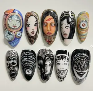 Horror-inspired nail art set featuring surreal spiral motifs, eerie eyes, and Junji Ito–style faces, blending black-and-white ink details with haunting color portraits