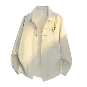 New Chinese-style long-sleeve top featuring bamboo leaf embroidery, a loose fit, frog buttons, design-forward retro high-end feel, and a drapey silhouette—a relaxed casual top with premium quality.