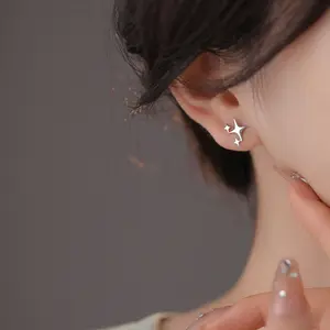 Asymmetrical four-pointed star earrings couple style screw star ear bone nail cross star earrings Asymmetrical four-pointed star earrings couple style screw star ear bone nail cross star earrings