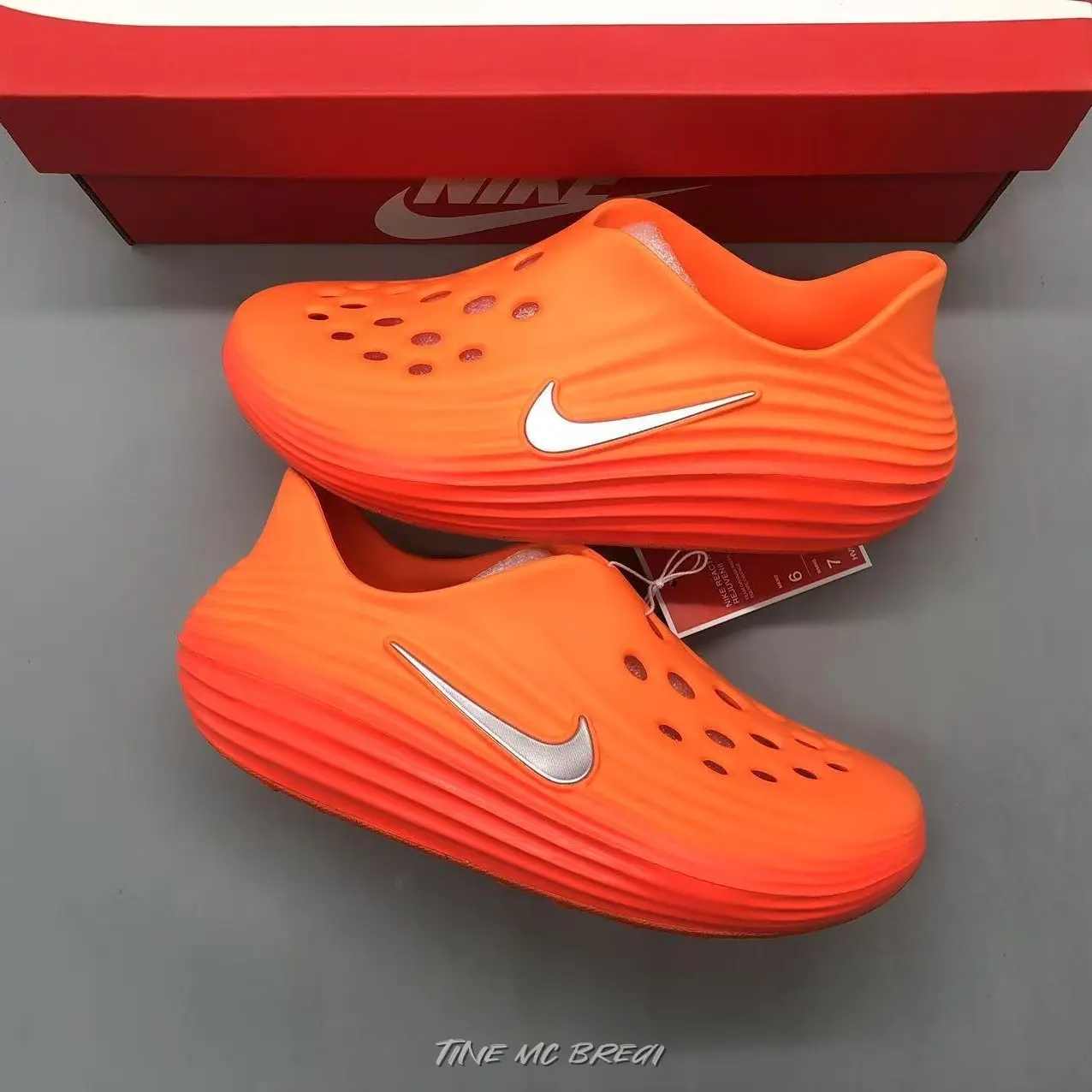 Vibrant Orange White-logo Slip-on Hollow Clogs, undulating ribbed integrated upper, densely textured wear-resistant anti-slip sole. Ideal for beach vacations and casual daily trips, energetic sunny-style casual styling