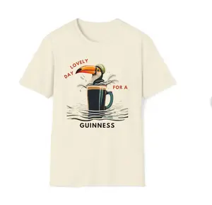 "Guinness Unisex Softstyle T-Shirt: Celebrate the Timeless Charm of Guinness with This Retro-Inspired Tee. Perfect for Guinness Fans and Those Who Appreciate Classic Advertisements. Make Every Day a Lovely Day for a Guinness!"