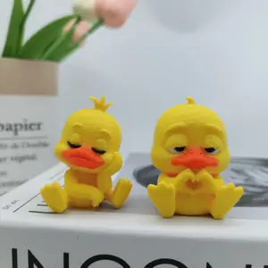 Two 3D-printed cute cartoon duck-shaped figurines, sitting in a casual and adorable duck statue - classic yellow and orange multi-color printed plastic ducks, perfect for cute desktop decoration, home decoration, office desks, car accessories