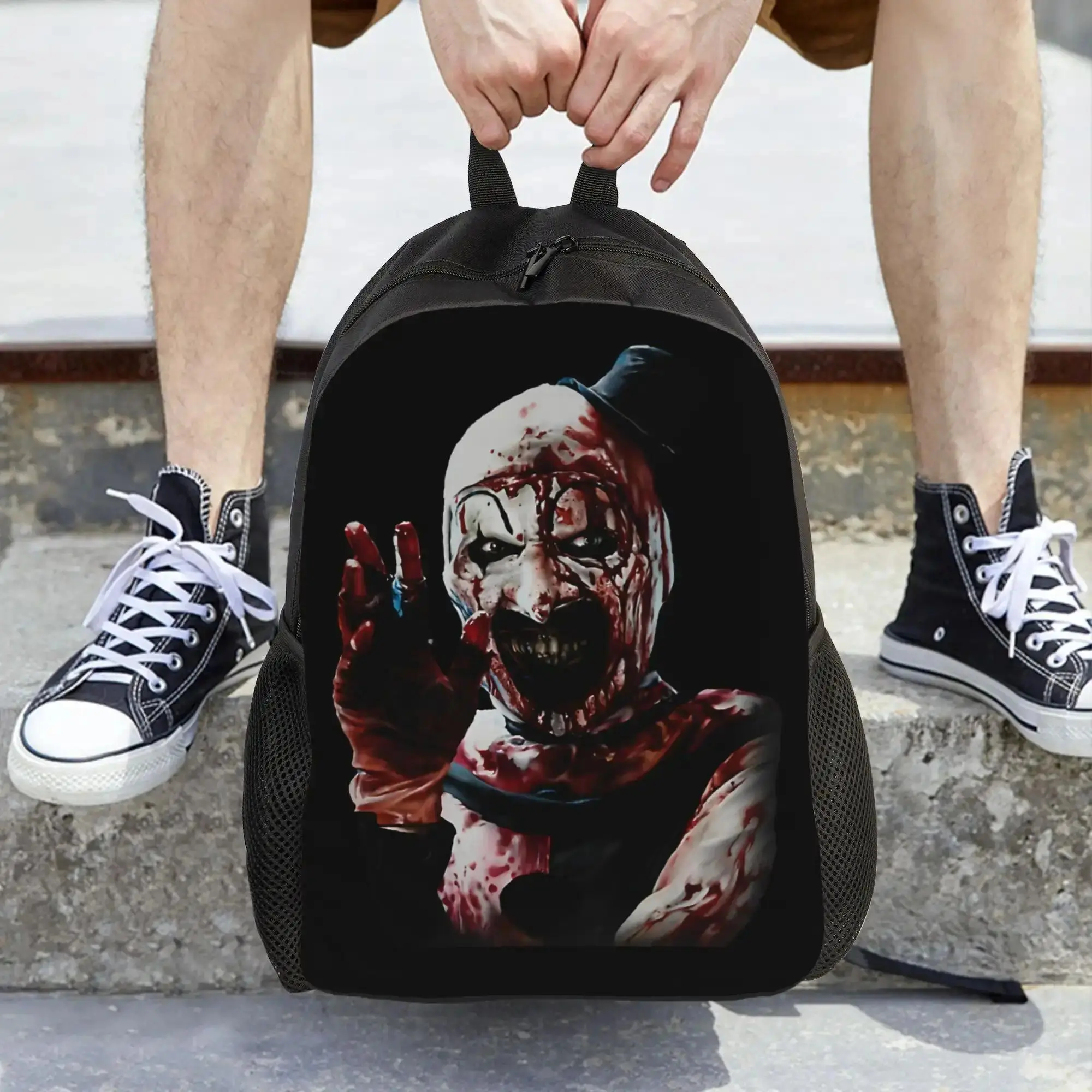 1pc Terrifier Movie Horror Backpack - Clown Terror Design, Heavy Bleed, Bold Print, Sturdy Construction, Synthetic, Chain Strap, Laptop Bag, Machine Washable, Zipper Closure, Halloween Gift for Adults, School & Travel Essentials