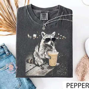 Raccoon Drinking Iced Coffee T-Shirt, Funny Animal Meme Graphic Tee, Retro Cinematic Unisex Shirt