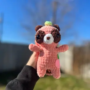 Hand crocheted peach raccoon