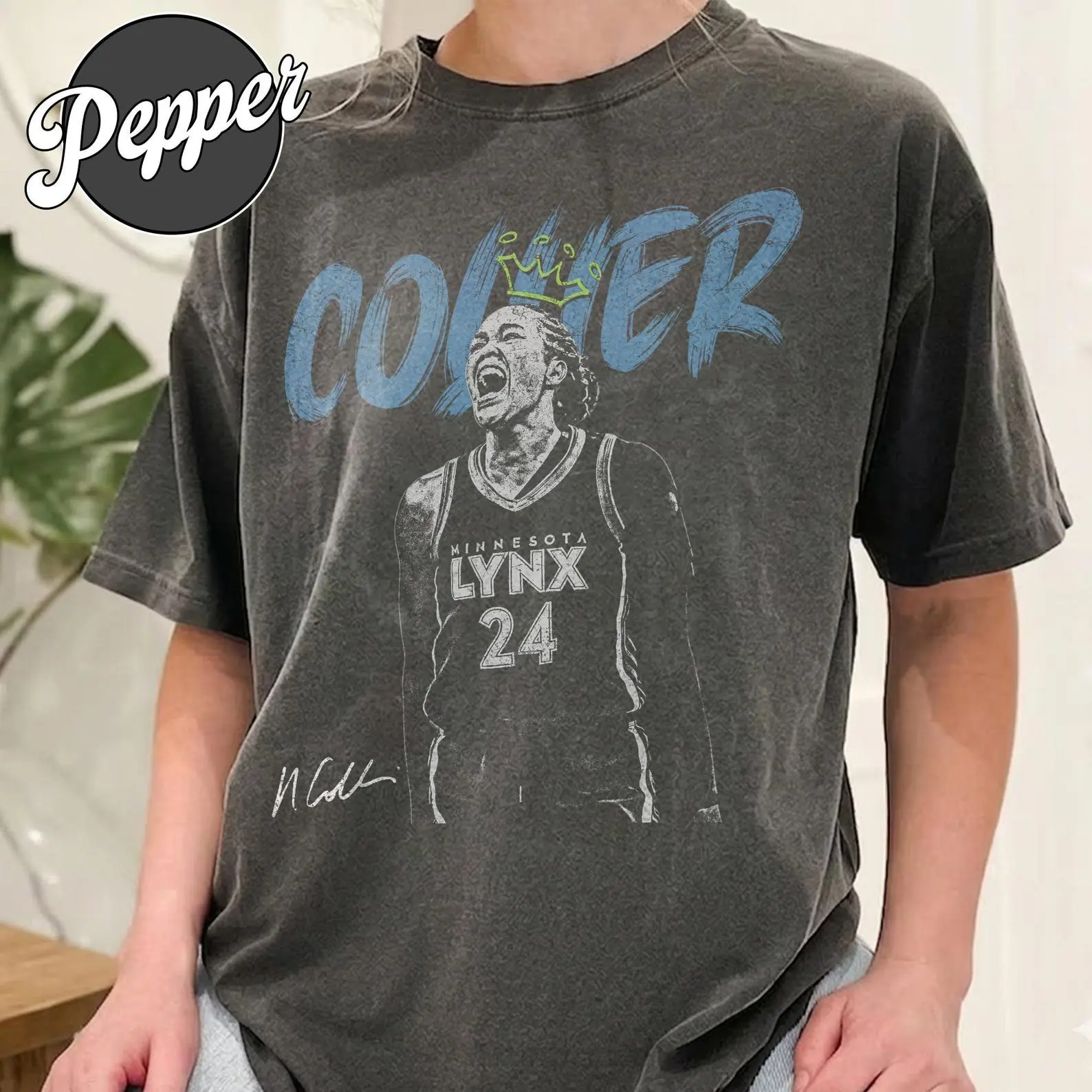 Cozy Comfort Colors Minnesota Basketball shirt featuring Napheesa Collier in vintage washed style. Heavyweight cotton tee offers relaxed unisex fit and soft faded 90s vibe for everyday wear.