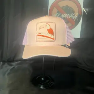 Pastel Pink Toucan Paradise Trucker Cap with Adjustable Fit and Vibrant Bird Design