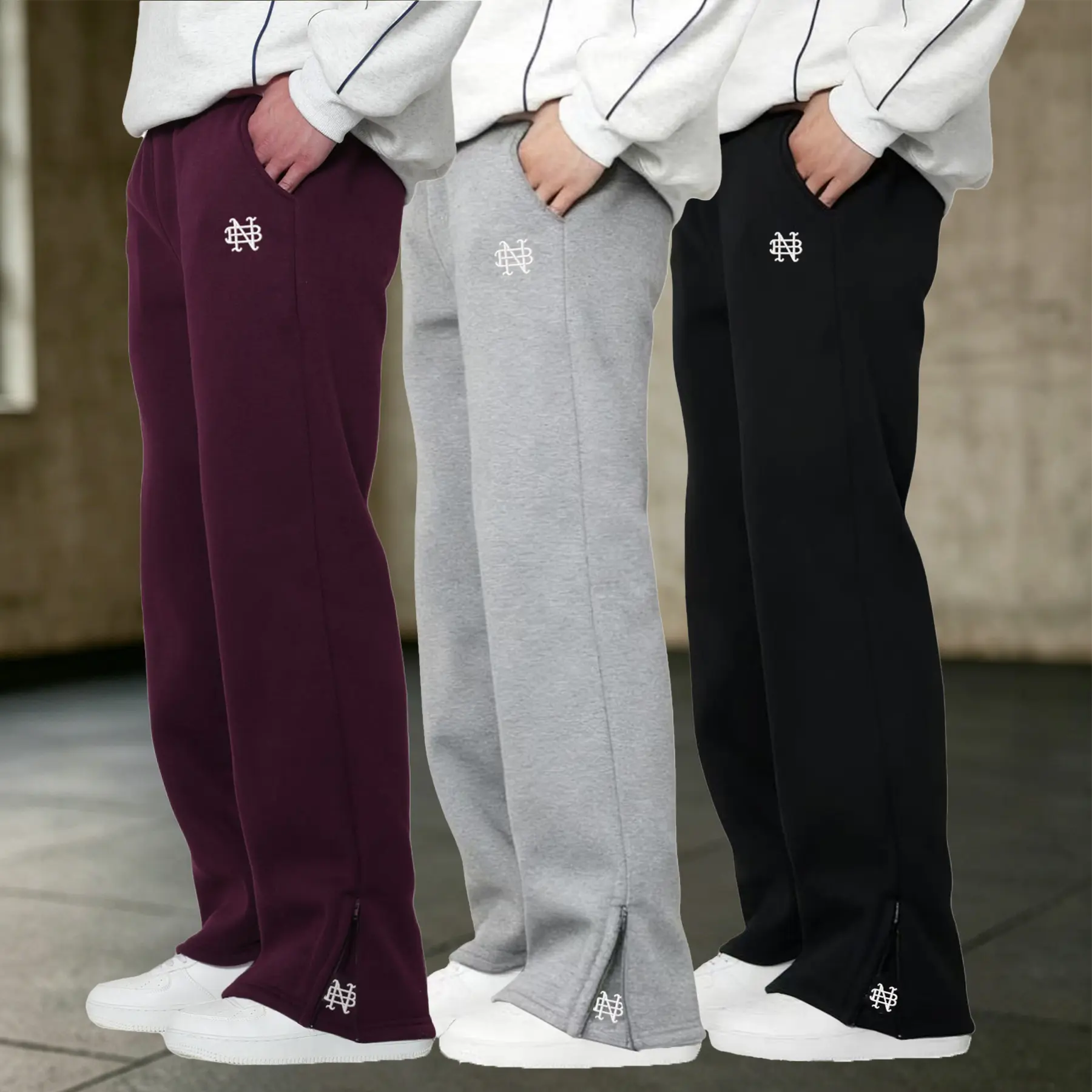 Unisex casual long pants; men’s comfortable jogging pants; embroidered design; street-style casual long pants; 2027 premium pants; everyday men’s sports/outdoor pants; comfortable athletic pants with embroidered logo; available in burgundy, gray, and blac
