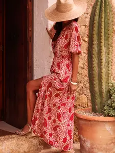 A women's red and white paisley pattern printed shirt style V-neck bell-sleeved slit dress, suitable for summer, suitable for seas vacations, dating, afternoon tea and other occasions.