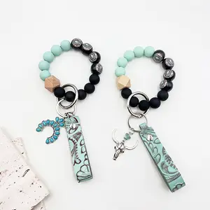 European and American Western cowboy style wooden bead handmade green genuine leather embossed alloy pendant keychain