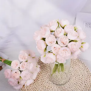 A bouquet of artificial flower arrangements with 27 peonies, raffia, dreamy camellias, and roses in an ins-style design, suitable for New Year's decorations