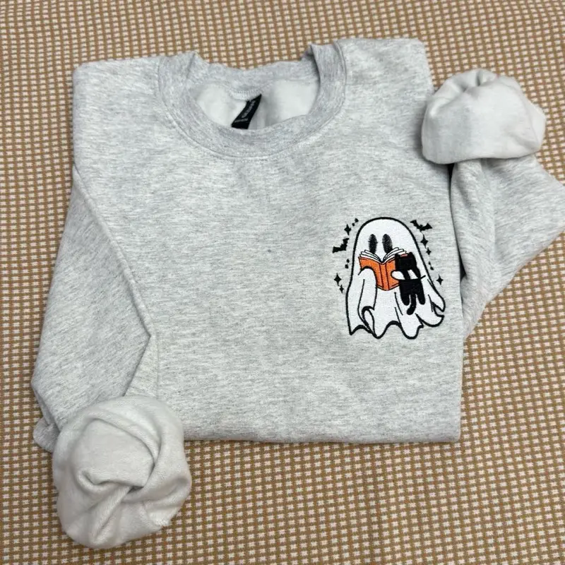 Ghost reading book with black cat embroidered Halloween spooky season sweatshirt