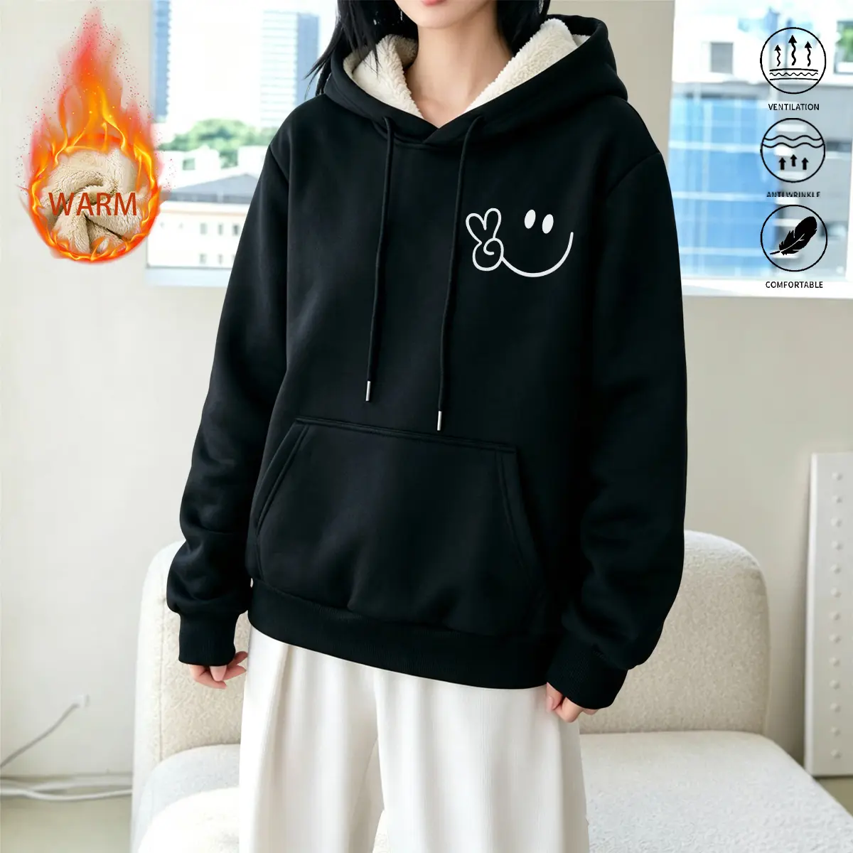 Women’s Sherpa fleece warm hooded sweatshirt featuring a cute heart smiley face print on the chest, an adjustable drawstring hood, and a large front pocket. Made from soft, comfortable fabric, it’s ideal for wearing at home during cold weather and for sty