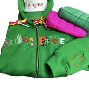 Spring Bundle - Green Hoodie with "Nurse Face" Embroidery, Pink Quilted Accessory, and Colorful Drawstrings Includes a green and white trucker hat and a small pouch