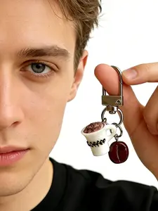A fun keychain pendant in the shape of a coffee cup and coffee beans, featuring a playful and cute style. It is suitable for coffee lovers to hang on their bags or keys in daily life, adding personality and a sense of life to leisure scenes such as commut