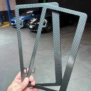 Set of 2 carbon fiber print on aluminum license plate frames with hardware.