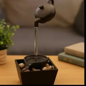 A Zen-themed tea pot fountain decoration, creating a Zen garden landscape, courtyard decoration, fashionable floating fountain for the garden, garden decoration, home decoration, gift for friends and relatives