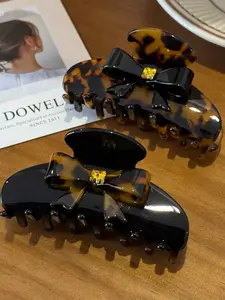 VVintage Tortoiseshell Bow Hair Clip: 3D bow with rhinestone accents for the ultimate sweet-and-edgy look! Secure grip, suitable for all hair types.
