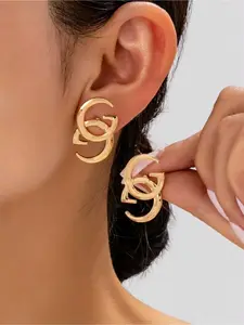 Gold double G letter earrings, minimalist luxury stud earrings. Elevate your style with this iconic double G earring. Sleek gold design adds a touch of luxury to any outfit.