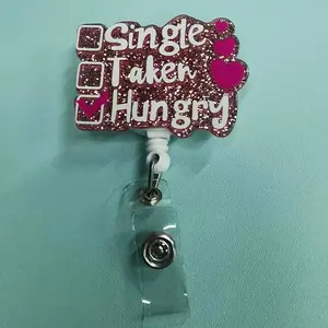 A fun-style work card retractable buckle, the main body is pink glitter design, with three options text "Single (single), Taken (with object), Hungry (hungry) ", of which "Hungry" is ticked by pink, Retractable Badge Holder
