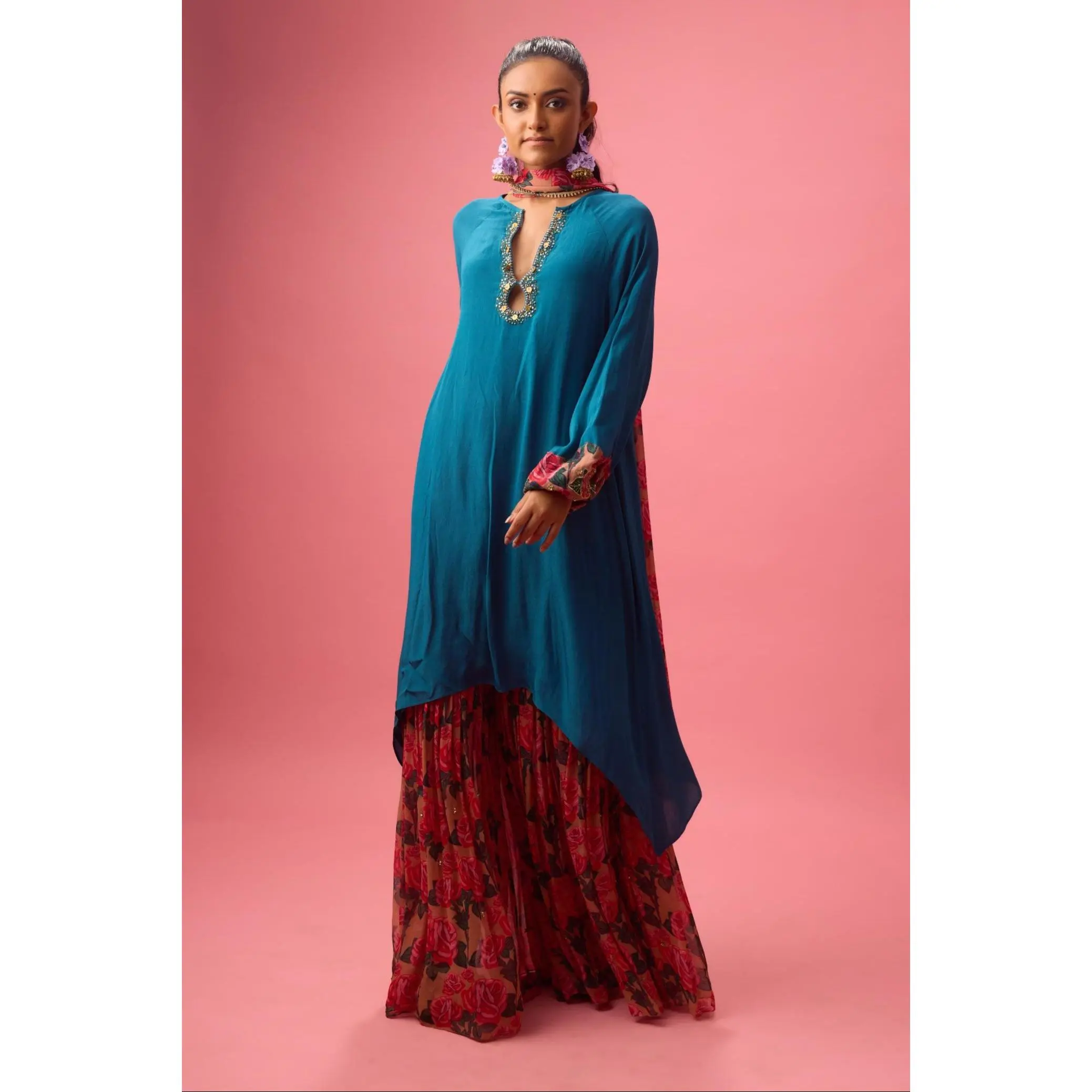 Blue solid crepe asymmetrical handwork kurta paired with printed sharara and dupatta