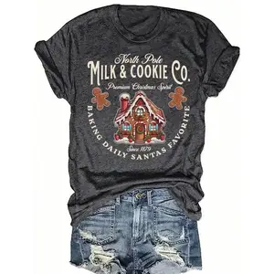 Women’s Christmas Pattern T-Shirt – Arctic Milk Biscuit Company retro holiday pattern featuring gingerbread houses and “baked” lettering; a casual crewneck tee, perfect for holiday gatherings and family get-togethers. GARMENTARY