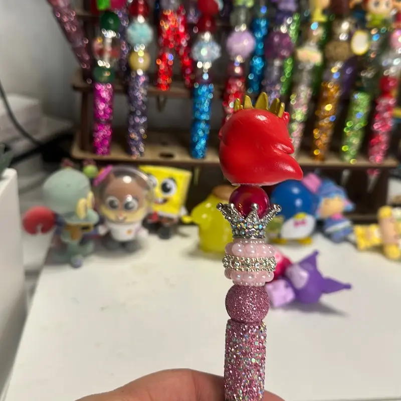 Fancy pen with topper