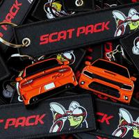 Orange 2-Sided Charger Keychain And Jet Tag