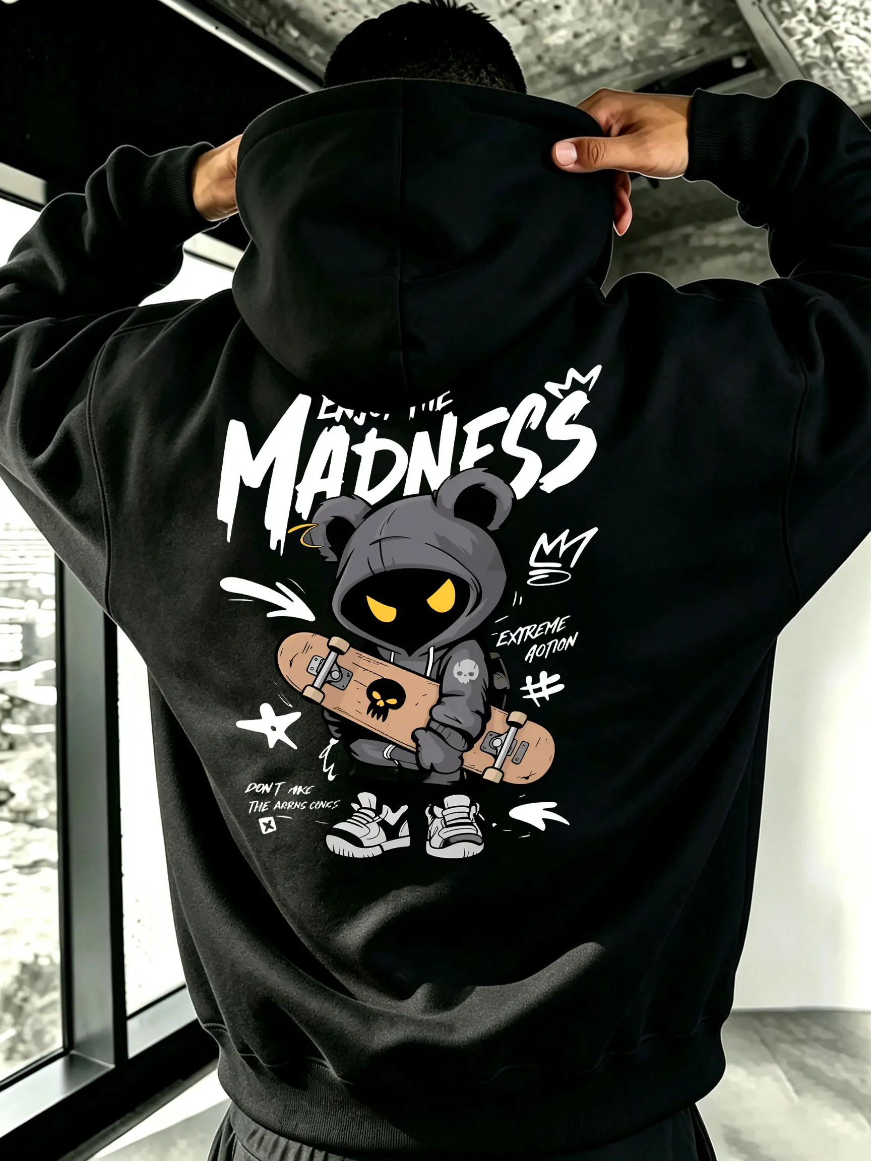 Enjoy the Madness hoodie — double print design, front handwritten brush-style lettering, back skateboard bear cartoon illustration; unisex oversized hoodie