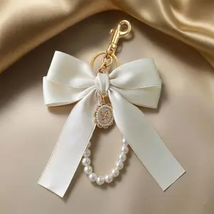 Cute Cream Silk/Satin Bowknot Bag Charm - Faux Pearl Beaded Wrist Strap, Keychain Jewelry, Purse Accessories, Women’s Decorative Purse & Backpack Pendant for Summer Vibes