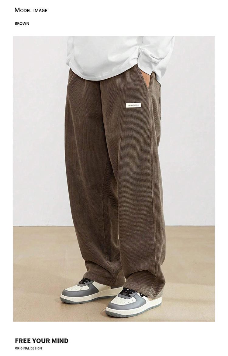 Men’s American vintage corduroy straight-leg pants—trendy, versatile brown casual long trousers with a drawstring waist and loose fit; simple, stylish men’s bottoms suitable for everyday wear and sports.