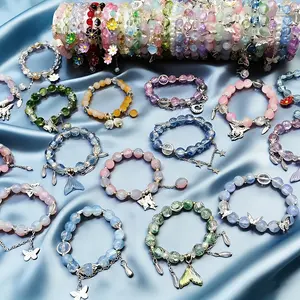 11Pcs Women's Glass Bead Bracelet Set with Flower Butterfly Pendants - Adjustable Elastic Cord Suitable for Wedding,, Everyday Jewelry Gift, Bling Bling for Valentine's, Christmas, New Year