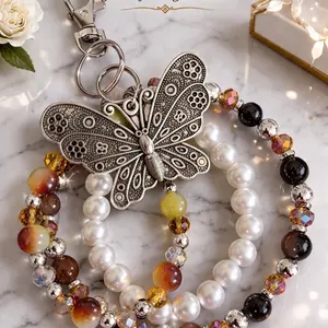 Crown Jewels by Deborah Butterfly Beaded Charm Purse Charm Keychain & Phone Accessory with Elegant Beads and Intricate Design