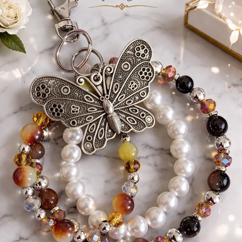 Crown Jewels by Deborah Butterfly Beaded Charm Purse Charm Keychain & Phone Accessory with Elegant Beads and Intricate Design