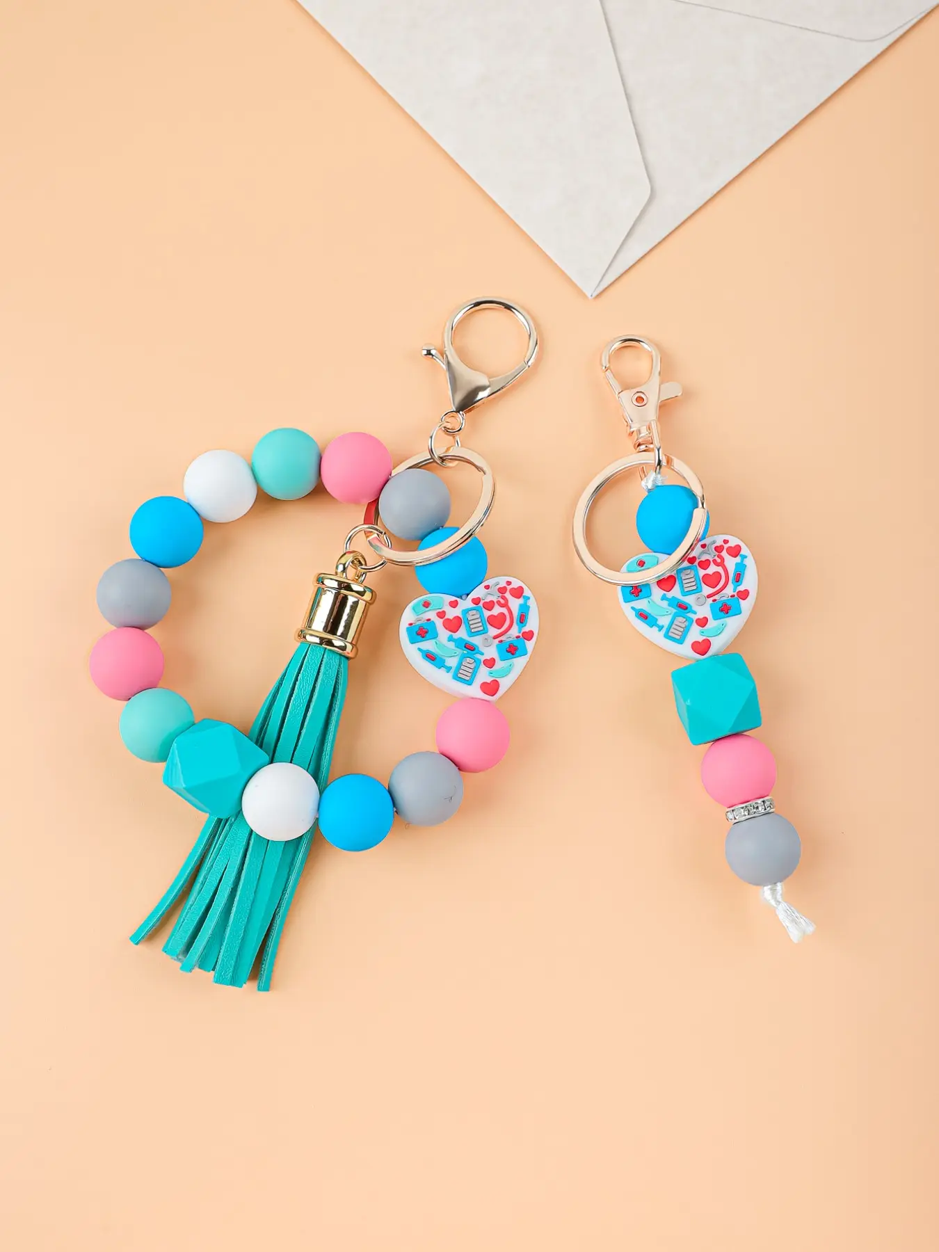 1PC Mediterranean-Style Silicone Bead Bracelet Keychain, Tassel Bead Keychain, Nurse Appreciation Gift, Healthcare Worker Keychain, Keychain for bags, Handmade Beaded Bag Charm, Heart-Shaped Silicone Bead Accessory, Nurses' Day Gift, Heart Design Keychain