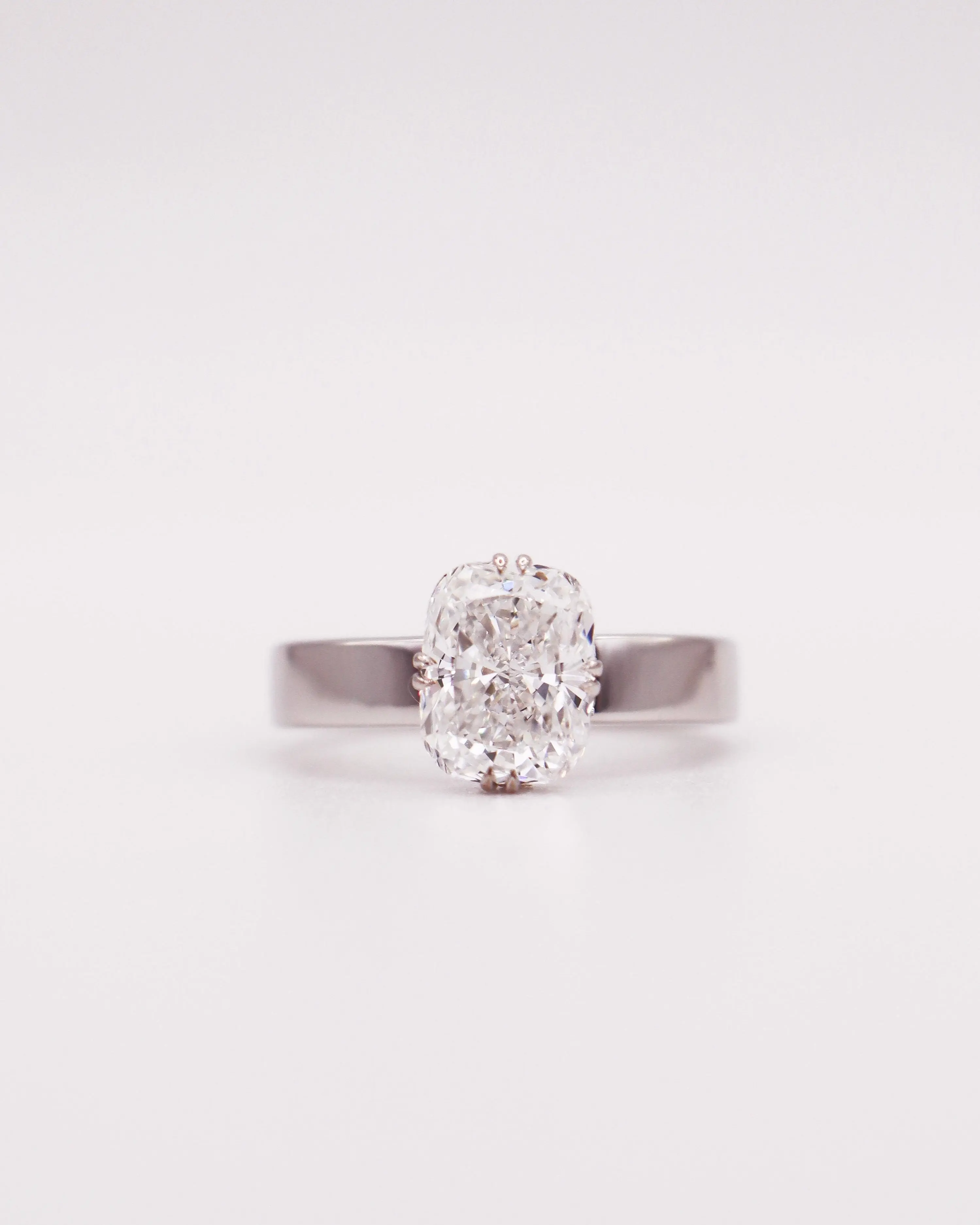 Wide Band Celestial Hidden Halo Elongated Cushion Ring
