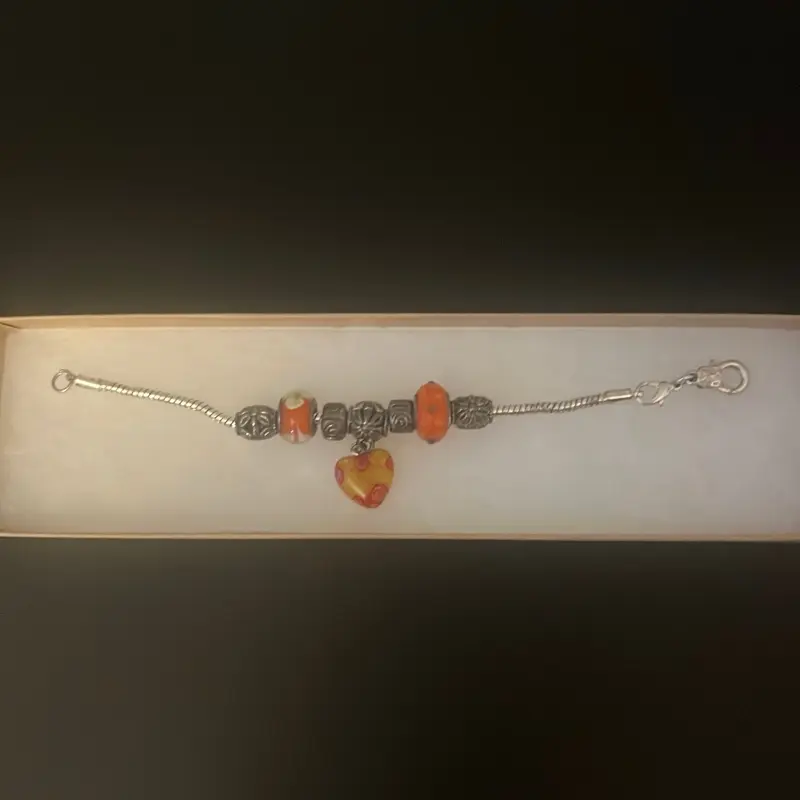 Handmade Charm Bracelet with Orange Beads and Unique Design in Display Box
