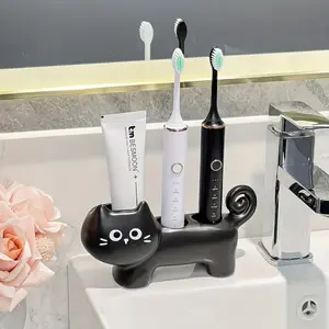 Toothbrush holder, high-quality ceramic material, toothbrush holder, creative cat-shaped bathroom storage rack, new portable drilling-free bathroom multifunctional storage, bathroom decoration bedroom living room kitchen universal.