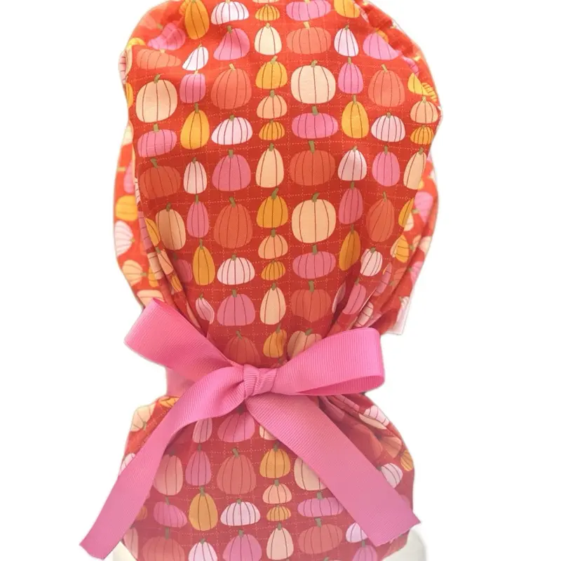 Pink pumpkin in orange scrub cap Pink pumpkin in orange scrub cap