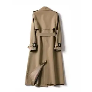 Women’s khaki solid double-breasted belted trench coat with elegant lapel collar and long sleeves, suitable for casual wear in autumn and winter; fitted minimalist outerwear with a basic design.