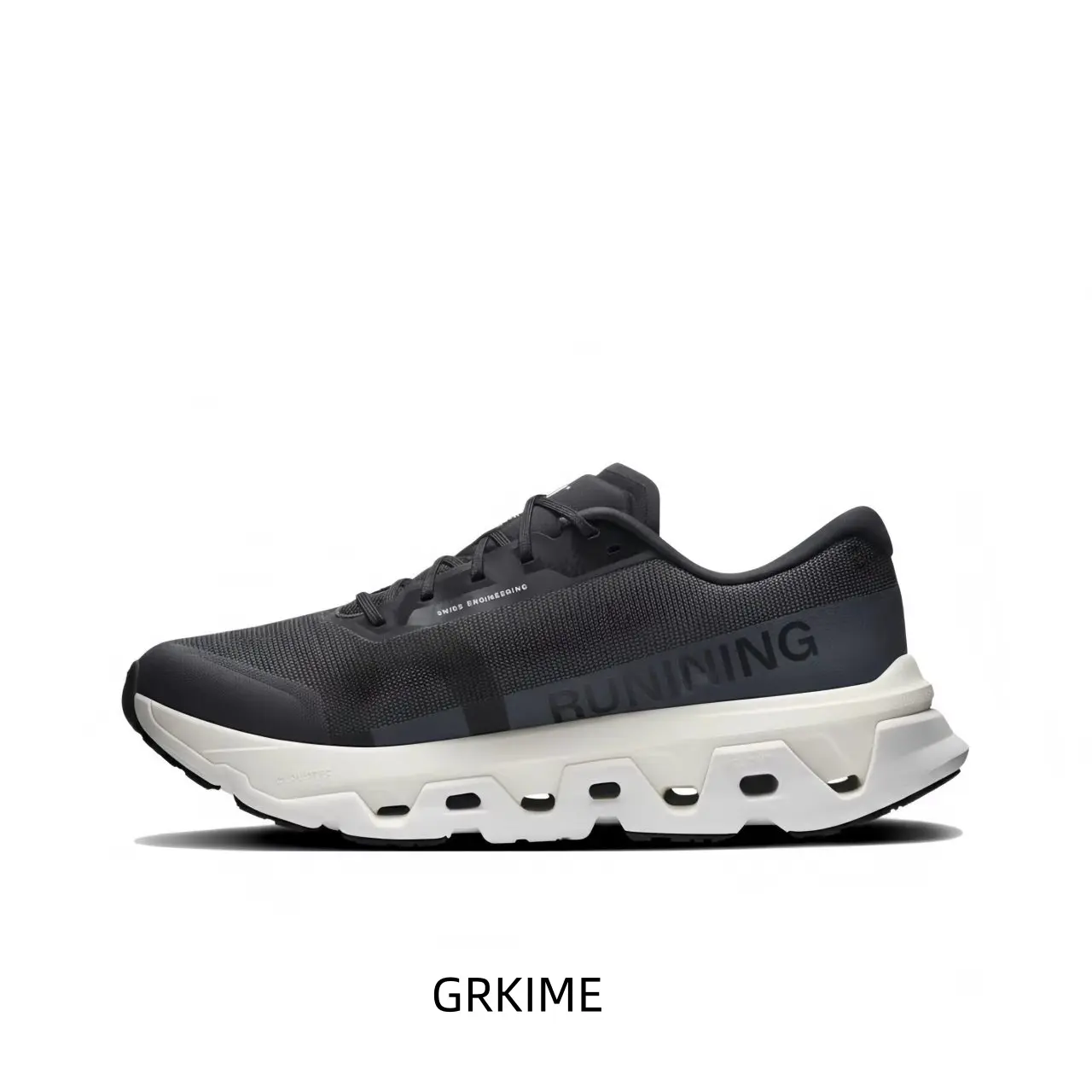 Deep Charcoal And Pure White Technical Running Shoe Featuring A Hollow-Core Segmented Midsole, A Dark Grey Anatomical Overlay, And A High-Contrast Color-Blocked Upper To Sole Transition
