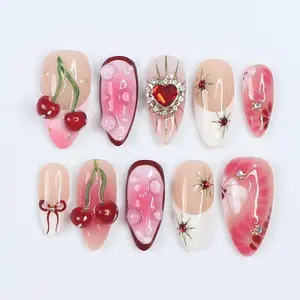 Press On Nails Golden Cupid with Cherry Charms | 3D Heart & Jewel Nails in Medium Almond | Handmade Romantic Nail Art for Holiday